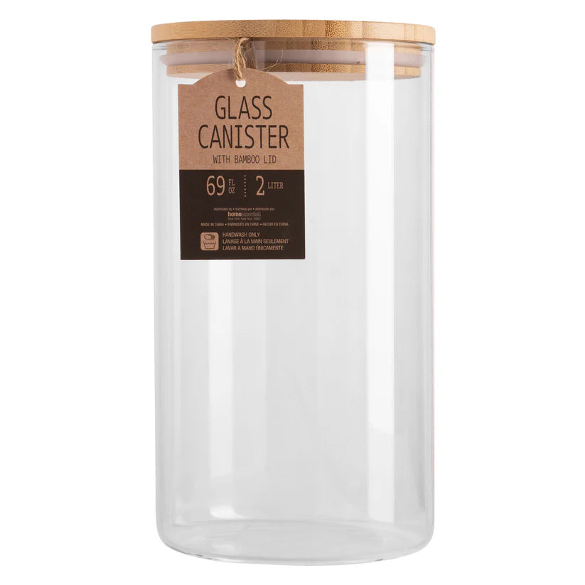 Clear glass canister with a wooden lid on a white background