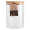 Clear glass canister with a wooden lid on a white background