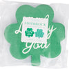 Green shamrock-shaped napkins with 'Lucky You' text on a white background