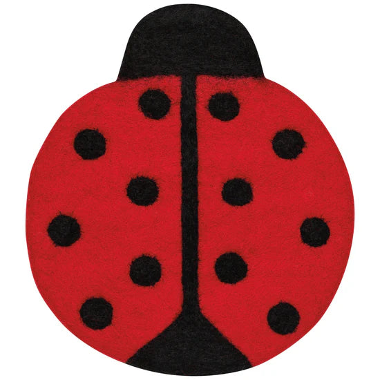 Red and black ladybug-shaped trivet on a white background
