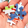 Colorful puzzle pieces held in a hand
