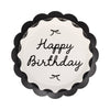 Scalloped paper plate featuring Happy Birthday message, black bows and black outer rim, on white background