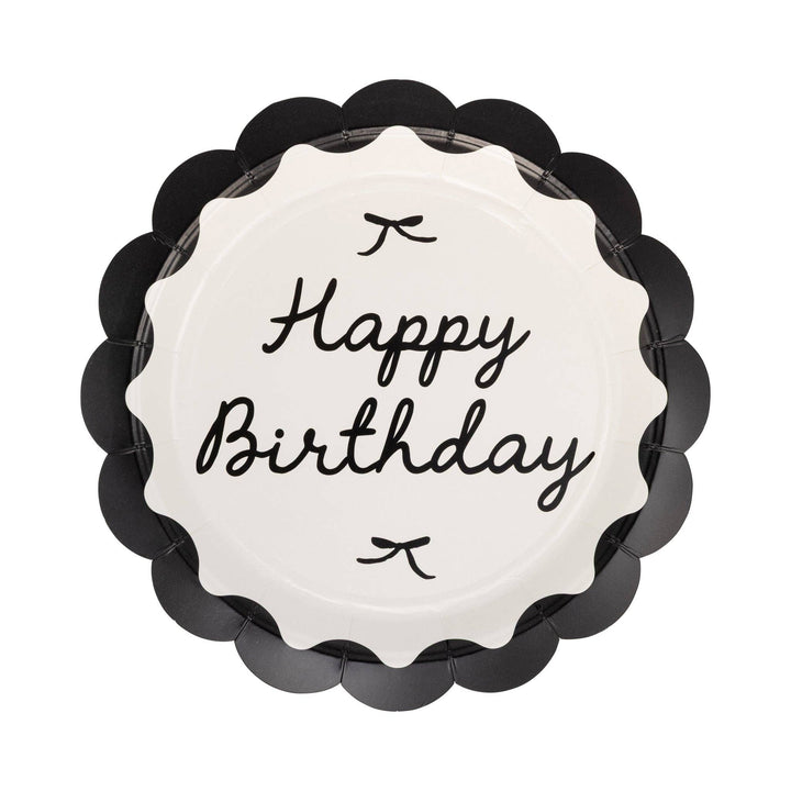 Scalloped paper plate featuring Happy Birthday message, black bows and black outer rim, on white background