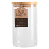 Glass canister with bamboo lid on a white background