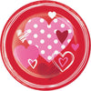 Red plate with pink hearts and polka dots on a white background