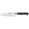 Santoku knife with a black handle on a white background