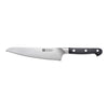 Bread knife with black handle on a white background