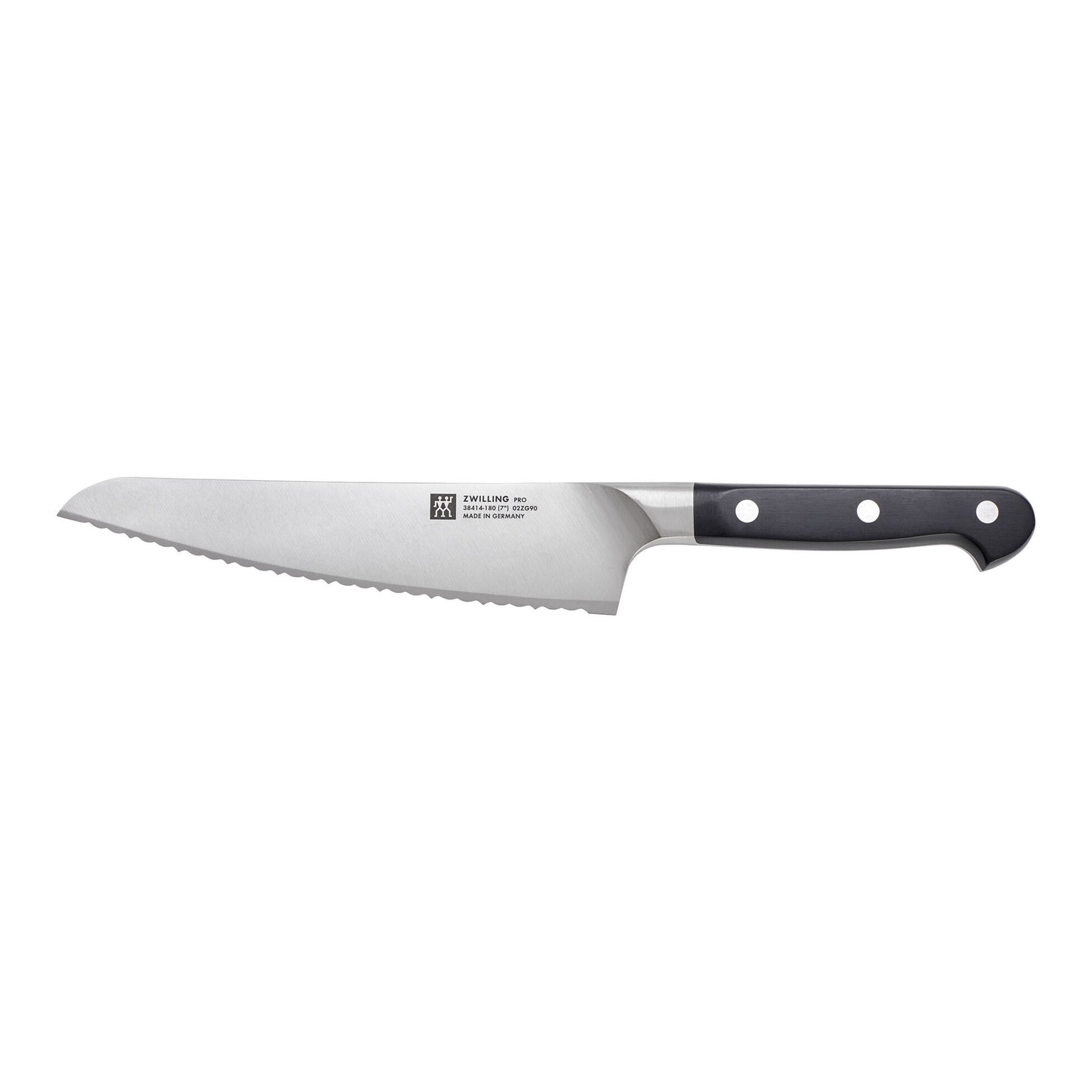 Bread knife with black handle on a white background