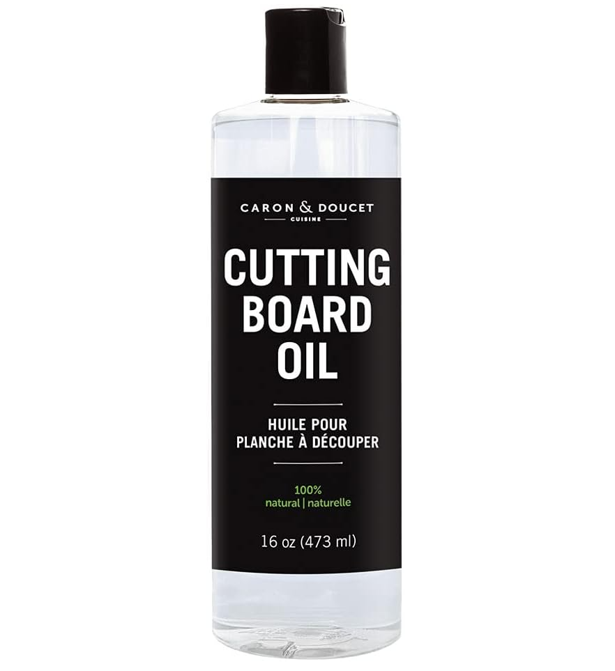 Bottle of Caron & Doucet cutting board oil on a white background