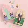 Two puzzle boxes with illustrations of the Statue of Liberty and George Washington, on a pink background.