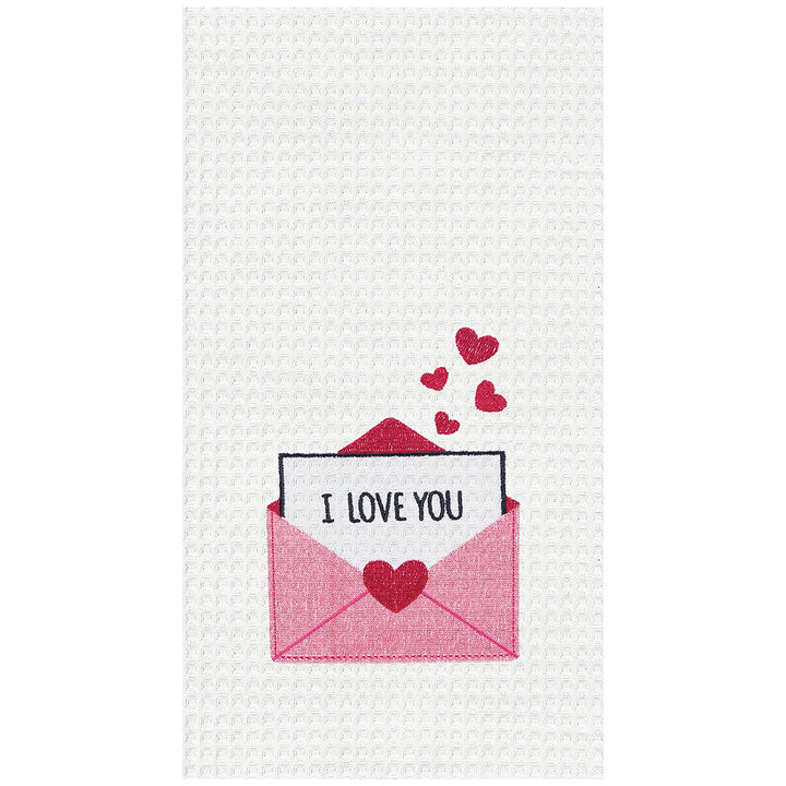 A white waffle-weave kitchen towel featuring a graphic of a pink envelope with a red heart, a white card reading 'I LOVE YOU', and four small red hearts floating above.
