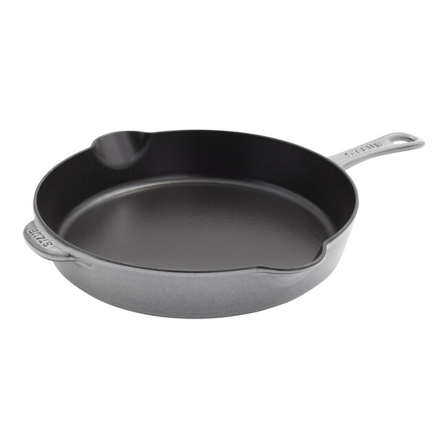 Gray cast iron skillet on a white background