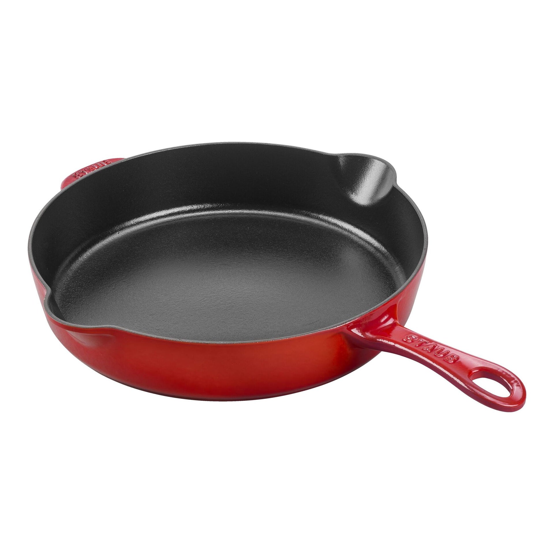 Red cast iron skillet on a white background