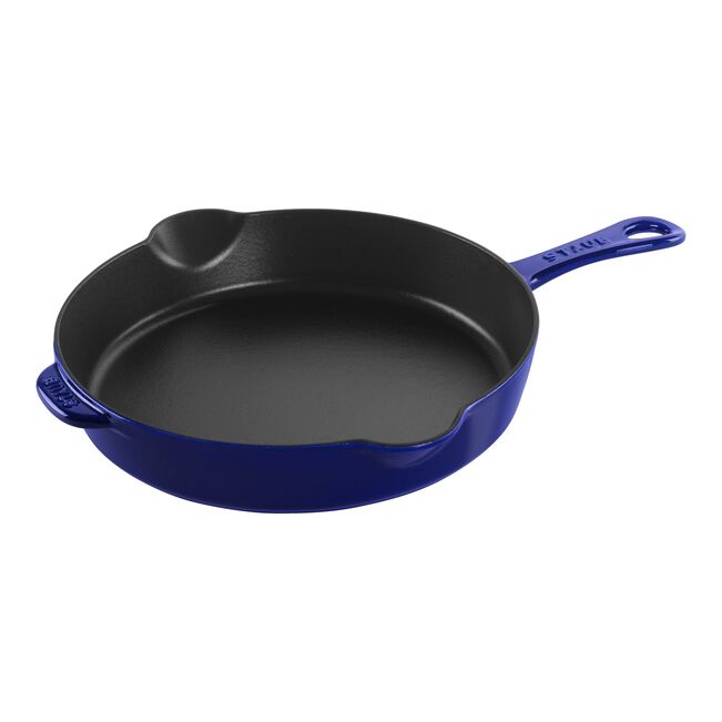 Blue cast iron skillet on a white background