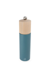 Blue pepper grinder with wooden top on a white background
