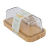 Butter dish with wooden base and clear lid on a white background