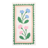 Napkin with floral design with pink and blue flowers on a white background