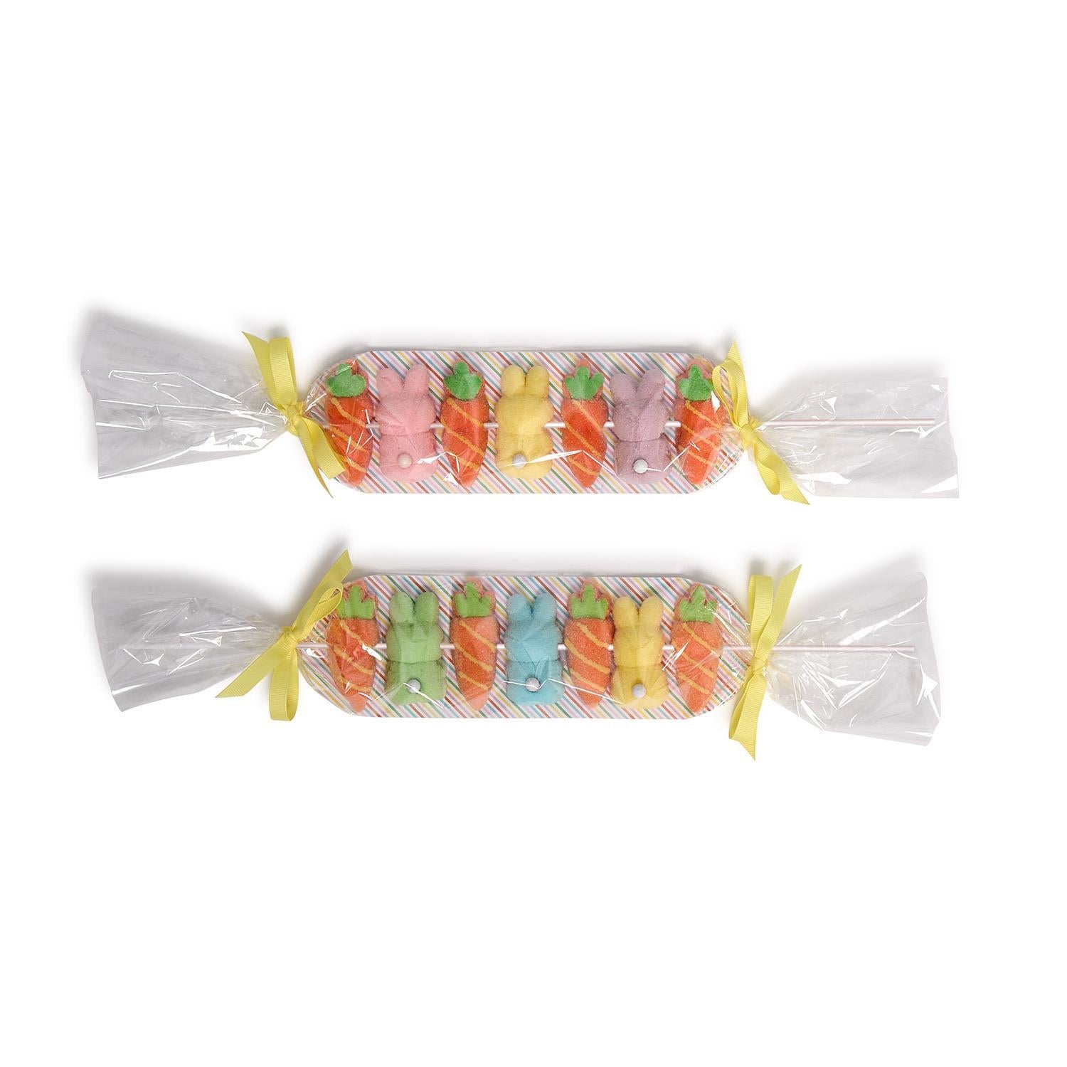 Colorful marshmallow candy shaped like carrots and bunnies on a white background, shown in two colorways.