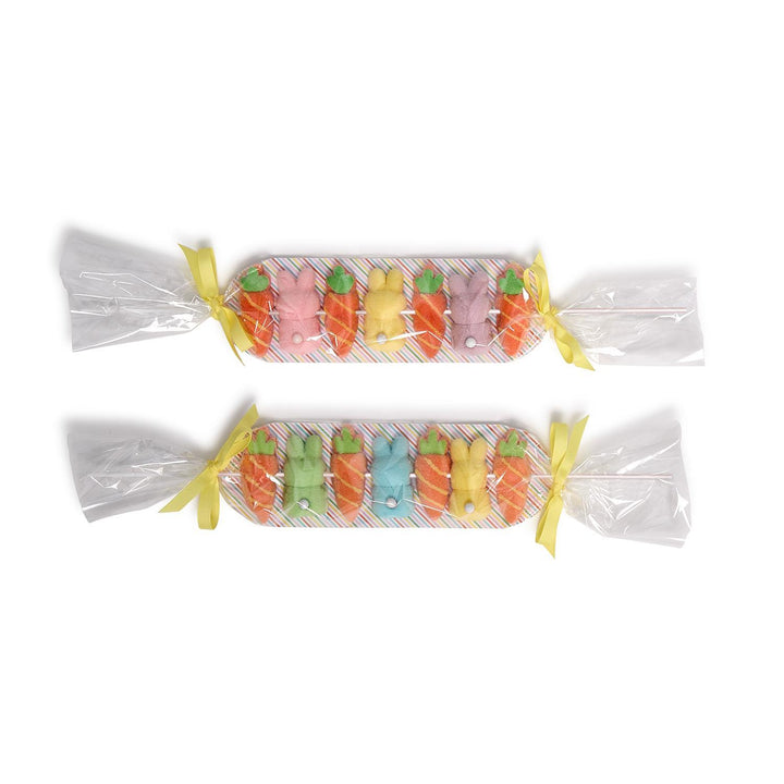 Colorful marshmallow candy shaped like carrots and bunnies on a white background, shown in two colorways.