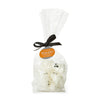 Bag of ghost-shaped marshmallows with a black ribbon and label on a white background