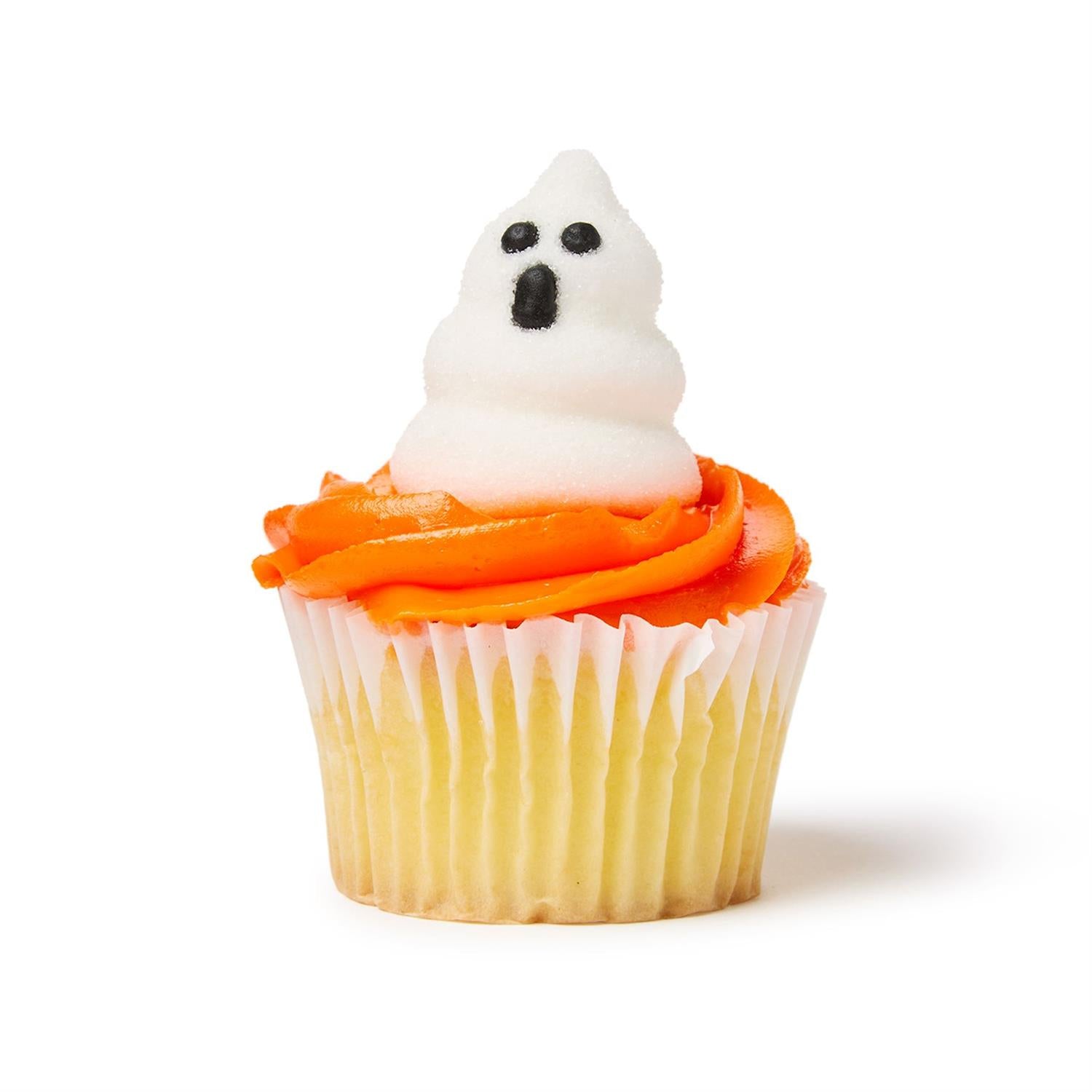 Decorated cupcake with a ghost-shaped marshmallow on top on a white background