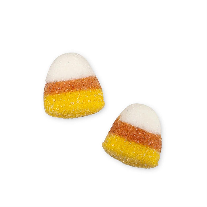 Two candy corn-shaped marshmallows on a white background
