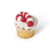 Cupcake with white frosting and a red and white candy cane marshmallow on a white background