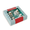 Set of melting snowman-shaped marshmallows in a decorative box on a white background