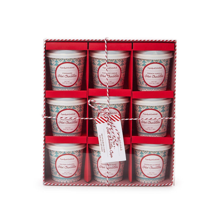 Set of nine hot chocolate cups in a decorative box with a tag.
