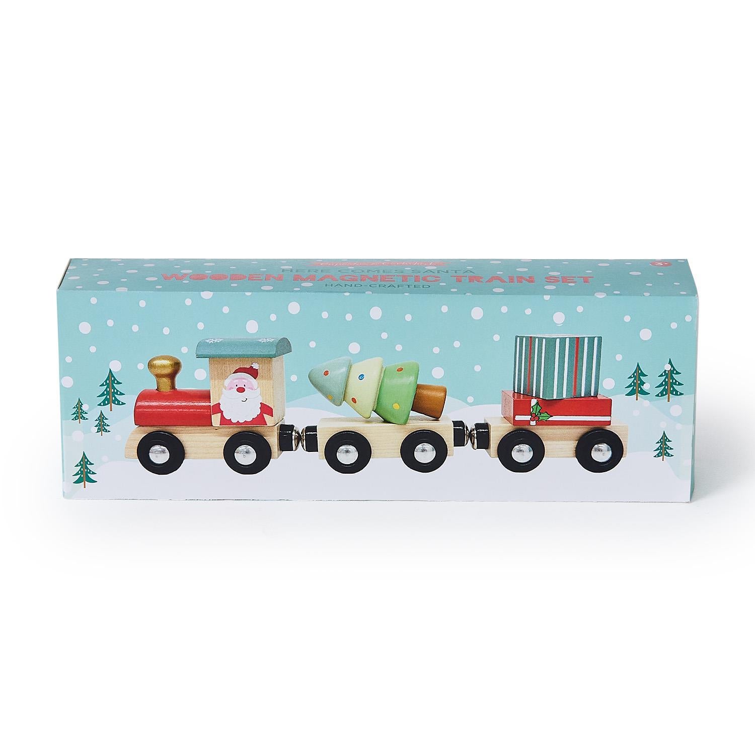 Wooden toy train set in packaging with a snowy landscape design