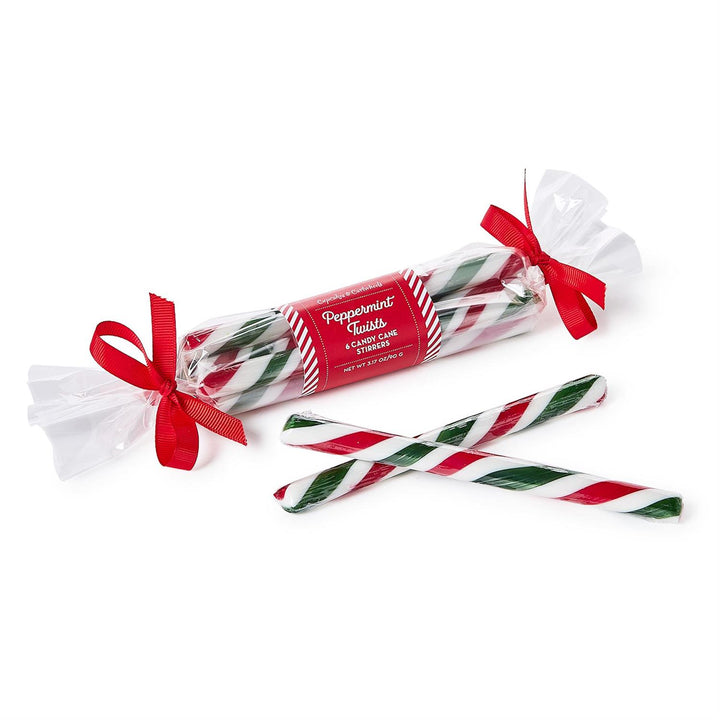 Packaged peppermint candy sticks with a red ribbon on a white background