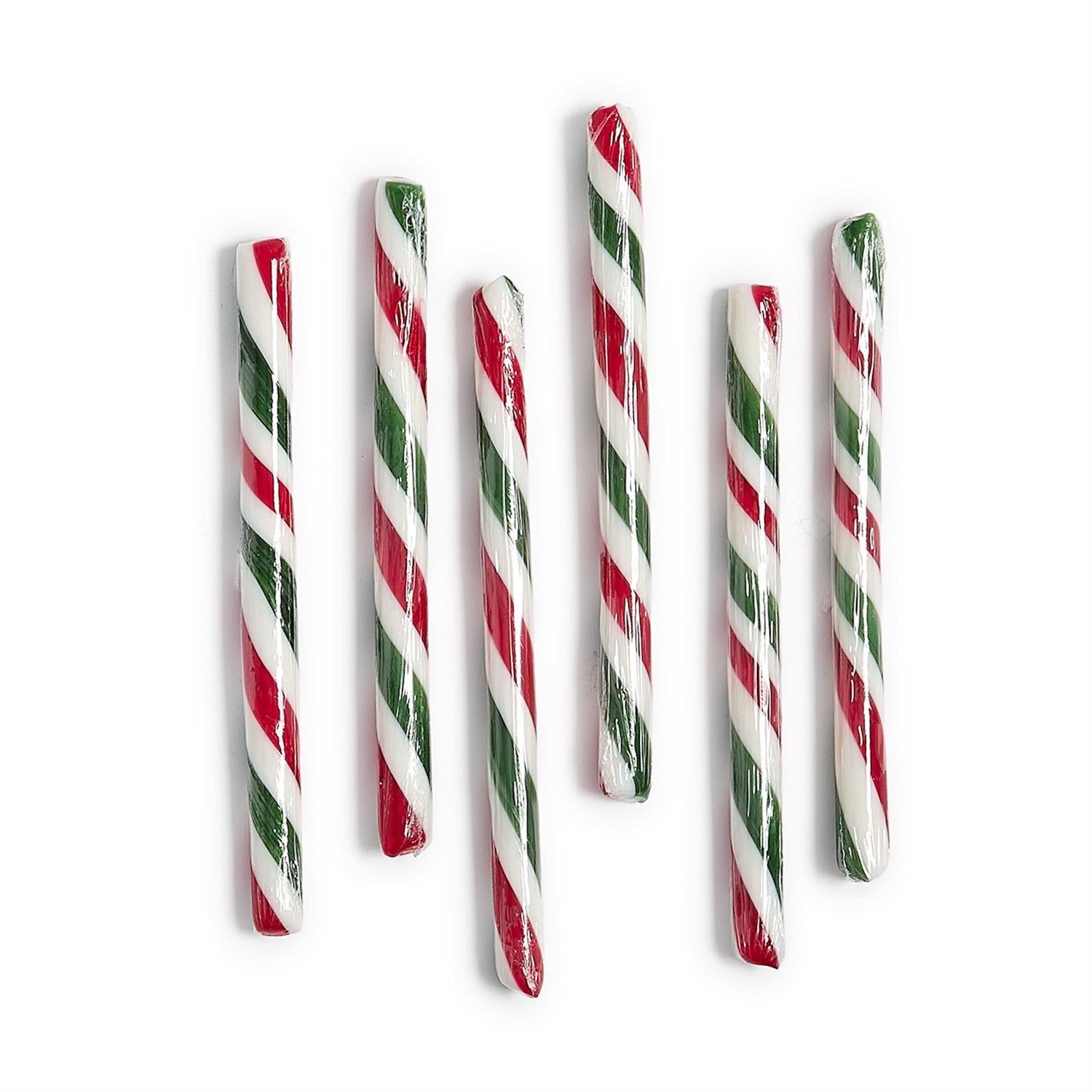Set of red and green striped candy sticks on a white background