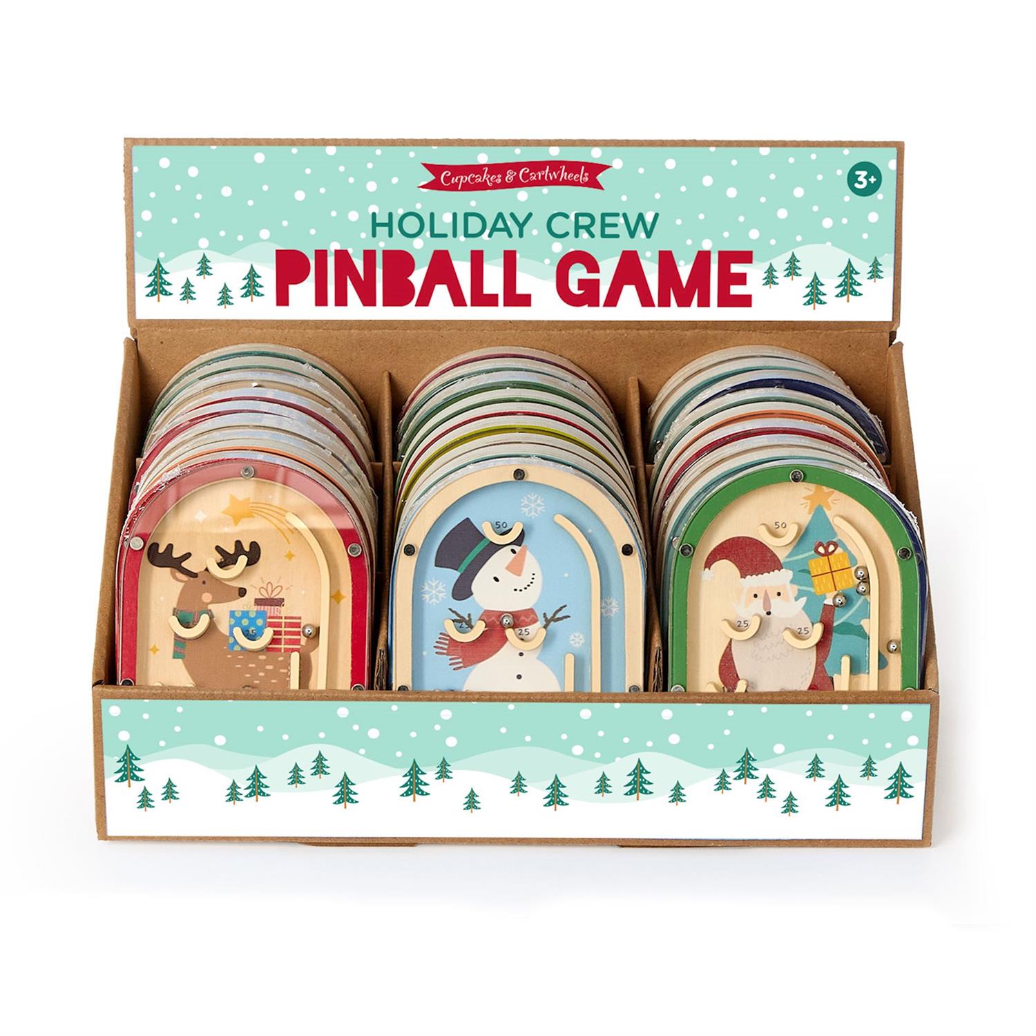 Boxed set of 'Holiday Crew' pinball game with festive illustrations on a white background