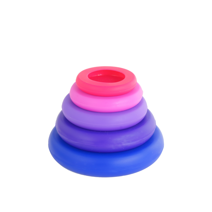 Stack of colorful silicone food covers on a white background