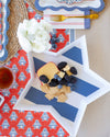 Star-shaped tray with fruit and cheese on a patterned tablecloth