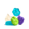 Five colorful monster gummy candies on a white background