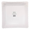 Bottom view of scalloped edge paper plate in a box with a visible brand label on a white background