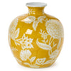 Yellow vase with white floral patterns on a white background