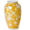 Yellow vase with white floral patterns on a white background