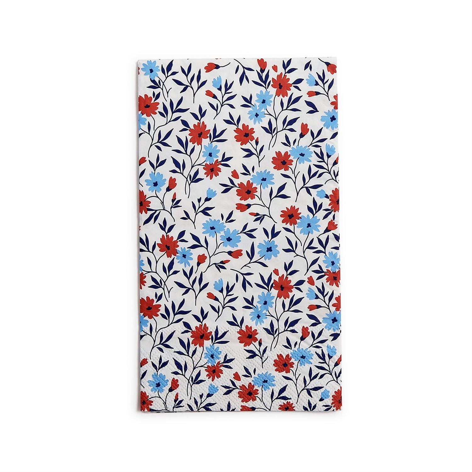 Floral patterned paper napkin with red and blue flowers on a white background