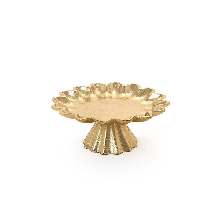 Gold decorative cake stand with scalloped edge on a white background