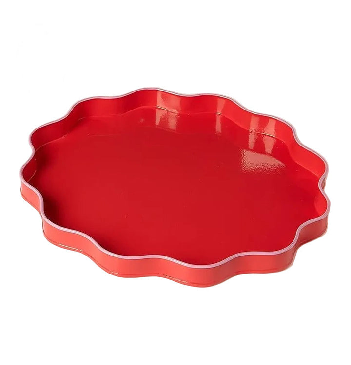 Red scalloped-edge tray on a white background
