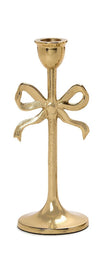 Gold candle holder with bow design on a white background