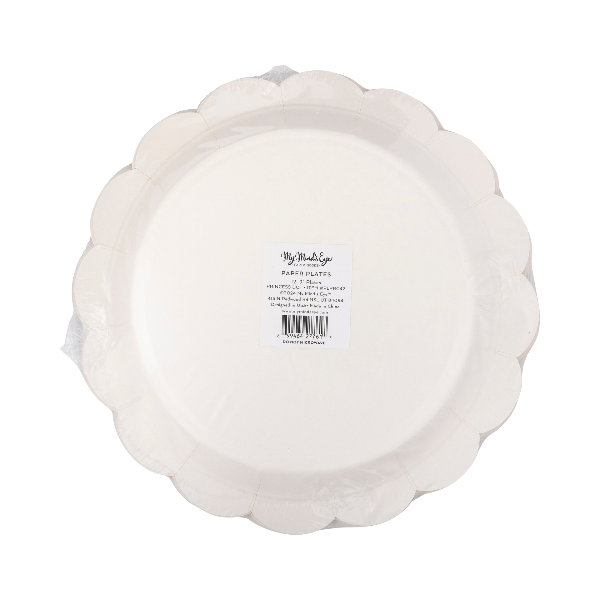 White paper plate with scalloped edge on a white background