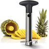 Pineapple slicer with a sliced pineapple and pineapple shell on a white background