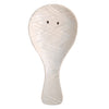 White ceramic spoon rest with mummy design on a white background