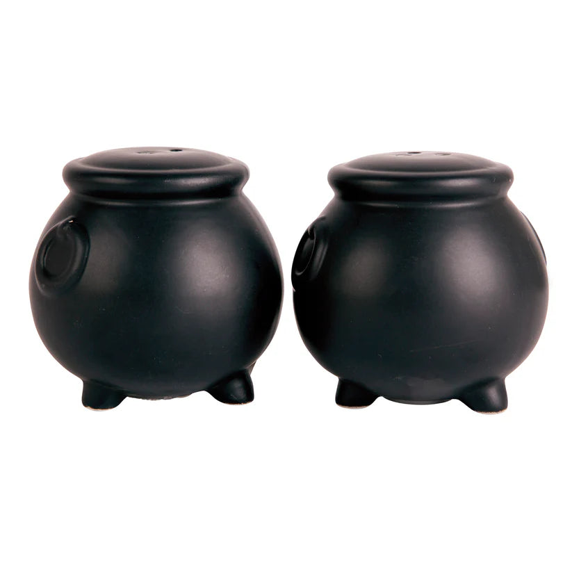 Two black cauldron-shaped salt and pepper shakers on a white background