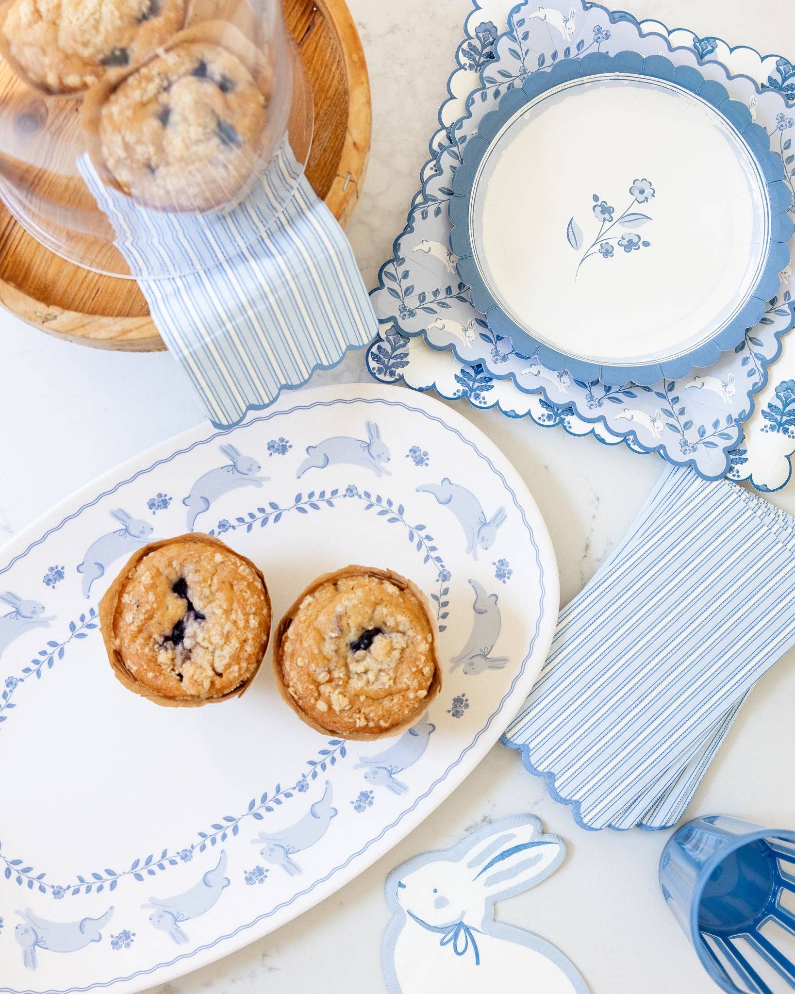 Blueberry muffins on a decorative plate with matching tableware