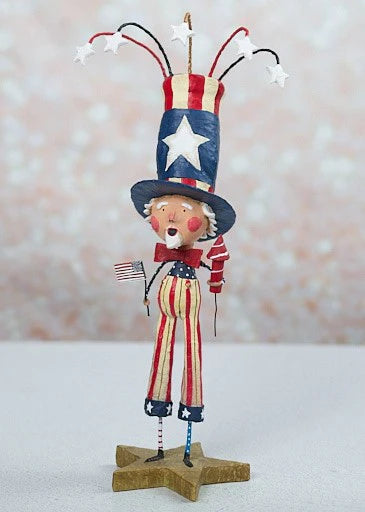 Decorative figure of a patriotic character with a top hat and American flag on a star-shaped base.