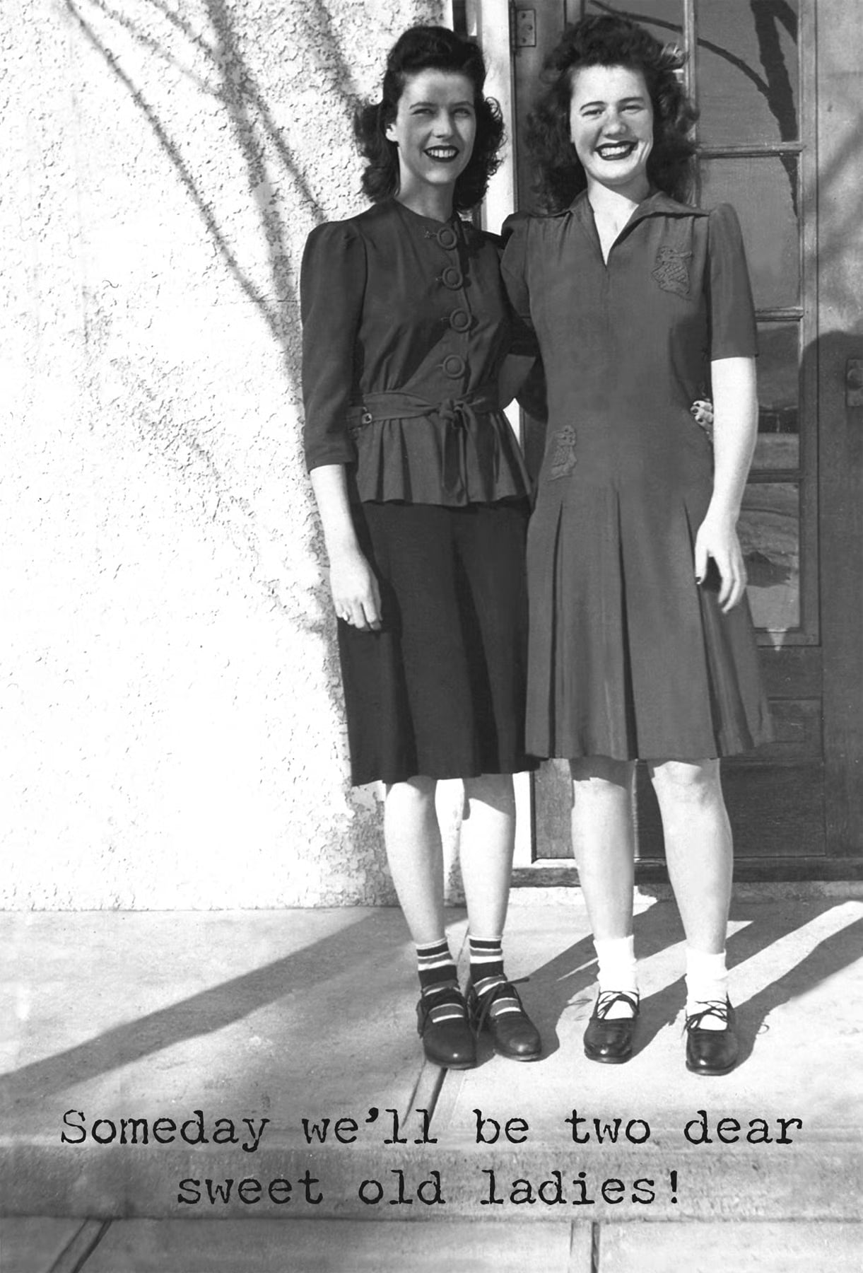 Two women standing side by side on a porch with text 'Someday we'll be two dear sweet old ladies!'.